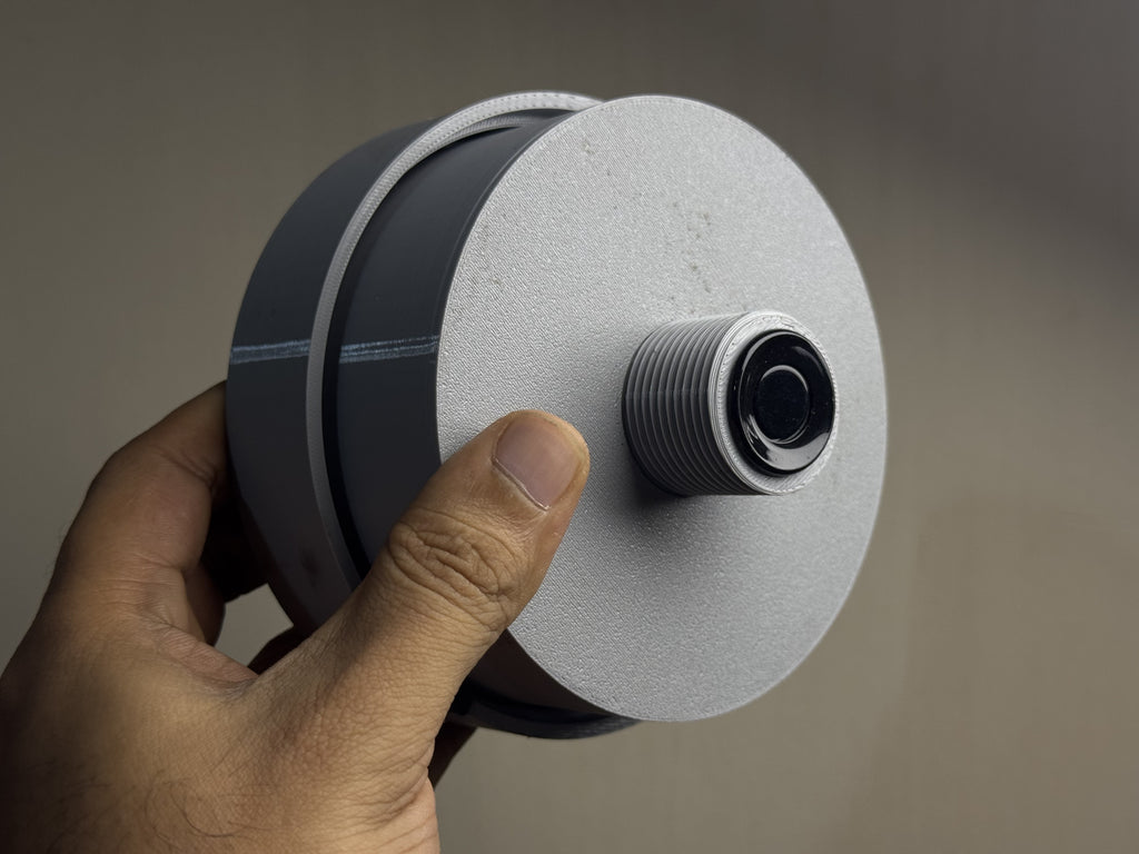 TankSync sensor mounted on a tank lid — solar panel visible
